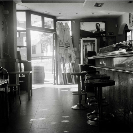 a black and white photo of a restaurant